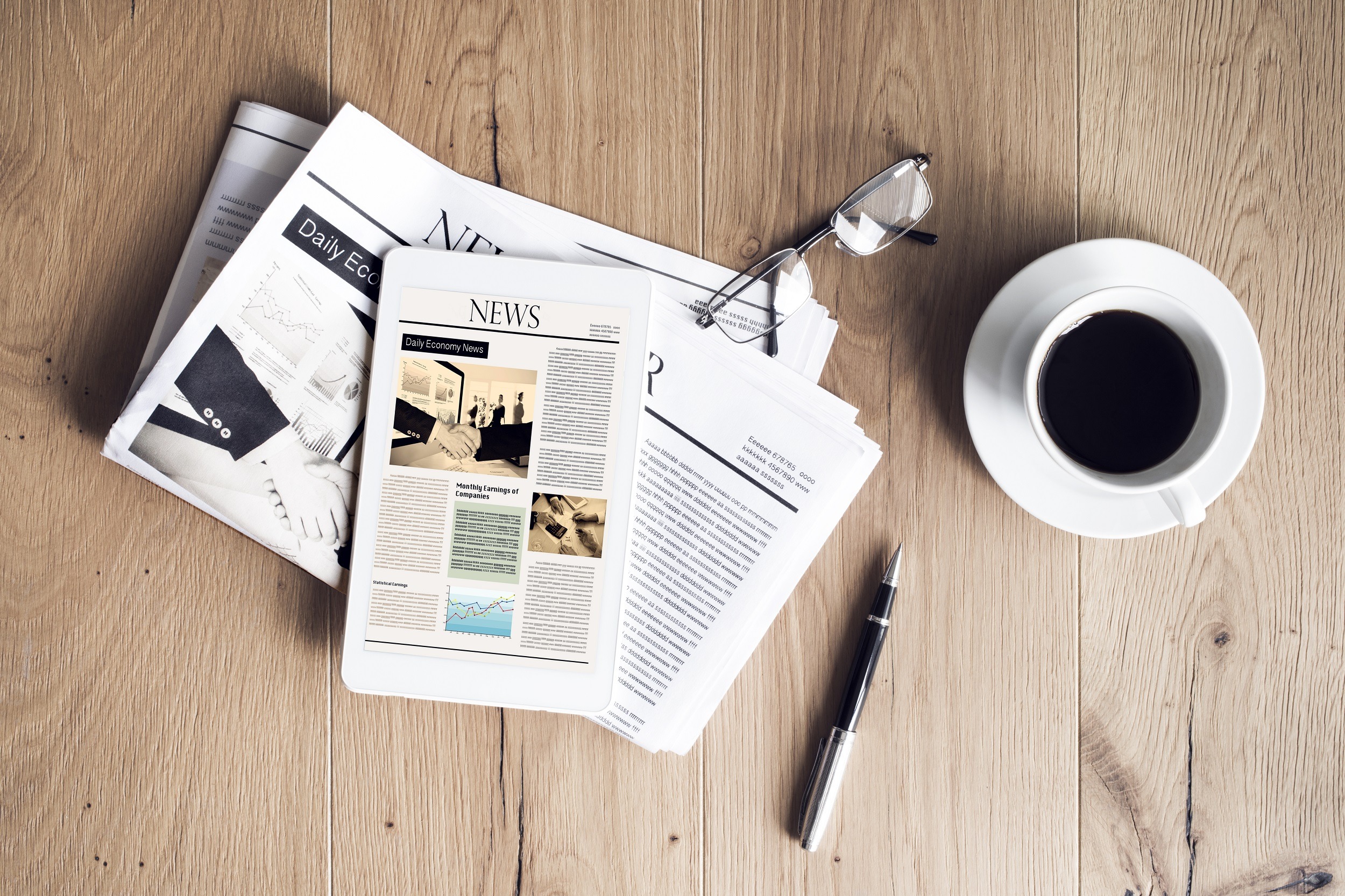 newspaper and tablet