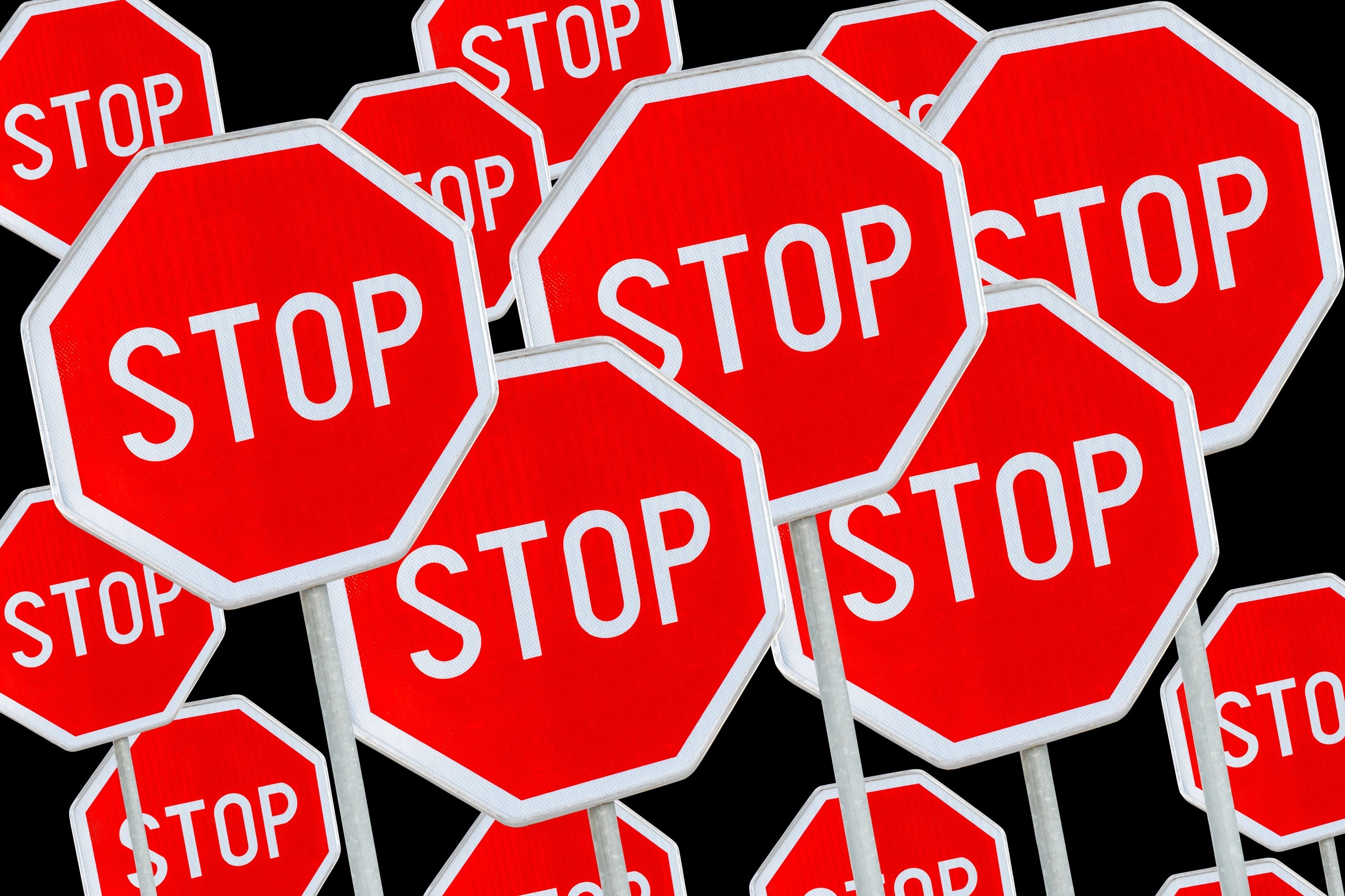 Multiple,Stop,Sign,Against,Black,Background